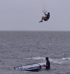 Kiter over windsurfer